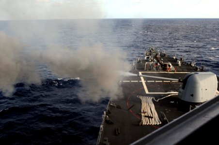 US Navy 101026-N-1854W-198 The guided-missile destroyer USS Mitscher (DDG 57) fires its forward 5-inch Mark 45-54-caliber lightweight gun during a