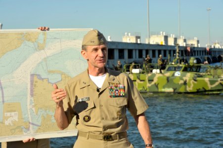 US Navy 101022-N-6889J-016 Rear Adm. Philip H. Cullom, director of the Energy and Environmental Readiness Division, briefs civic and military leade