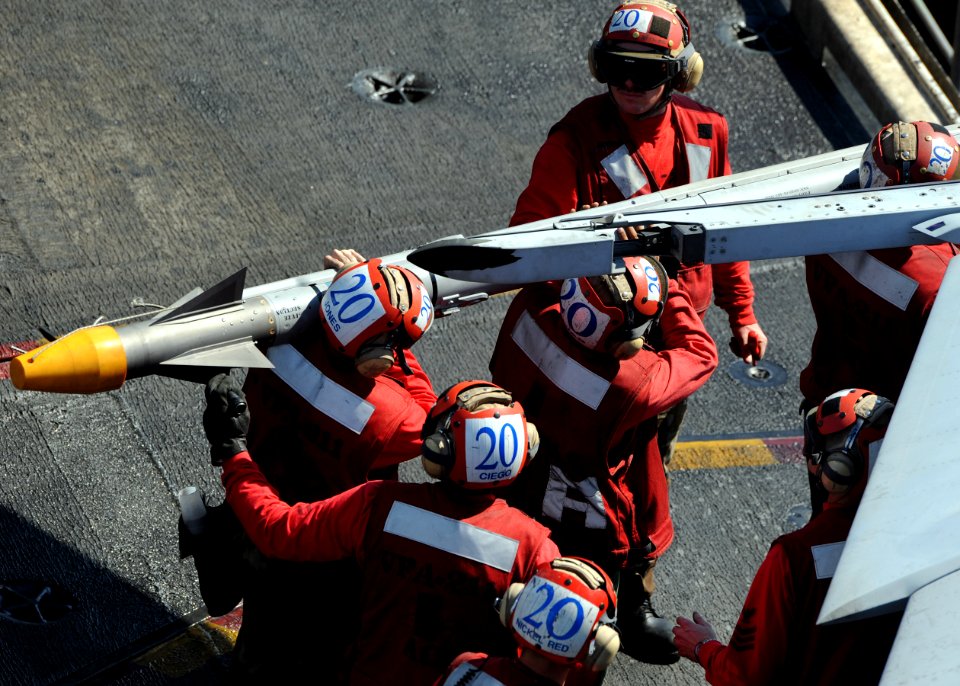 US Navy 101023-N-0569K-016 Sailors assigned to the Checkmates of Strike Fighter Squadron (VFA) 211 load a CATM-9 missile onto an F-A-18F Super Horn