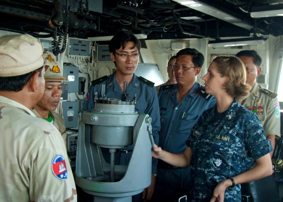 US Navy 101027-N-6770T-220 Ensign Krystal Roberts answers questions from Royal Cambodian Navy and customs personnel during a tour of the guided-mis
