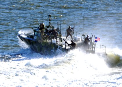 US Navy 101022-N-9565D-128 Sailors assigned to Riverine Group 1 stand their post aboard Riverine Command Boat (Experimental) (RCB-X)