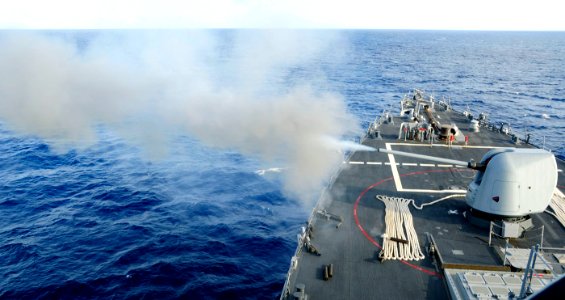 US Navy 101026-N-8913A-082 The guided-missile destroyer USS Mitscher (DDG 57) fires its forward 5-inch Mark 45-54-caliber lightweight gun during a