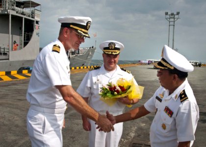US Navy 101025-N-6770T-147 Royal Cambodian Navy Rear Adm. Ros Veasna, right, welcomes U.S. Navy Capt. David Welch, left, commander of Task Group 73
