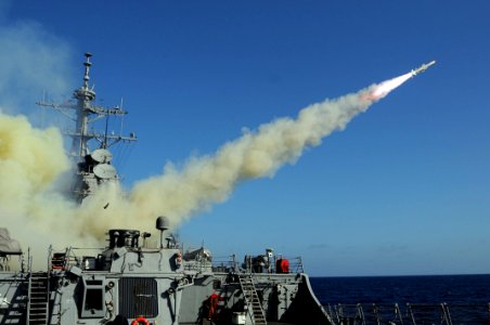 US Navy 101027-N-1854W-010 he guided-missile destroyer USS Mitscher (DDG 57) launches a Harpoon anti-ship missile at the ex-USNS Saturn during a si