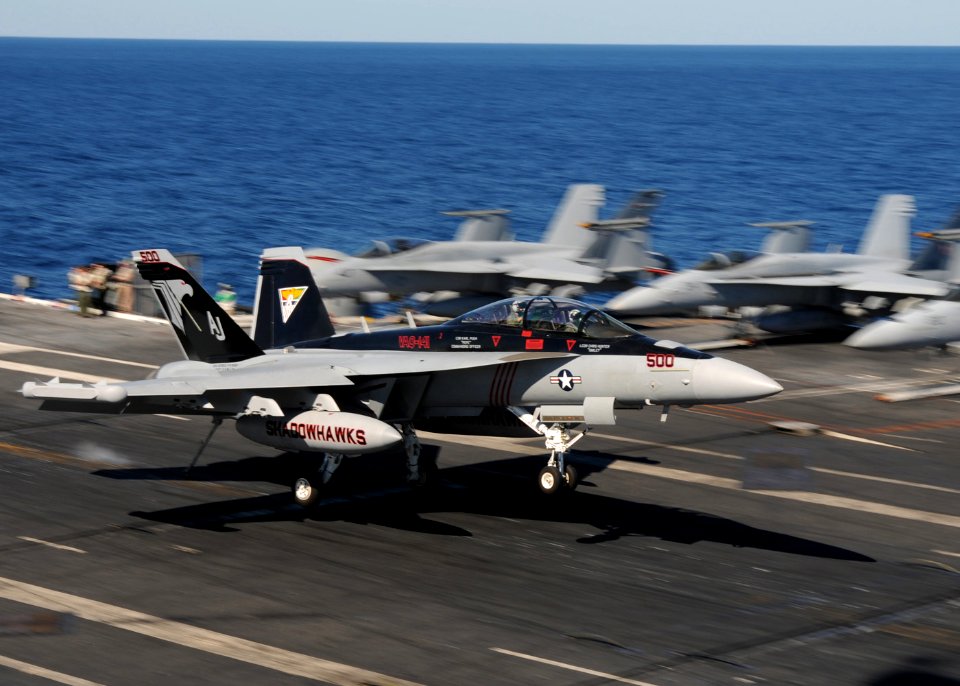US Navy 101023-N-3737T-426 An EA-18G Growler assigned to Electronic Attack Squadron (VAQ) 141 lands during flight operations aboard the aircraft ca