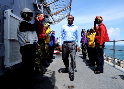 US Navy 101025-N-7680E-015 President of Guyana Bharat Jagdeo walks through the sideboys upon his arrival aboard the multi-purpose amphibious assaul