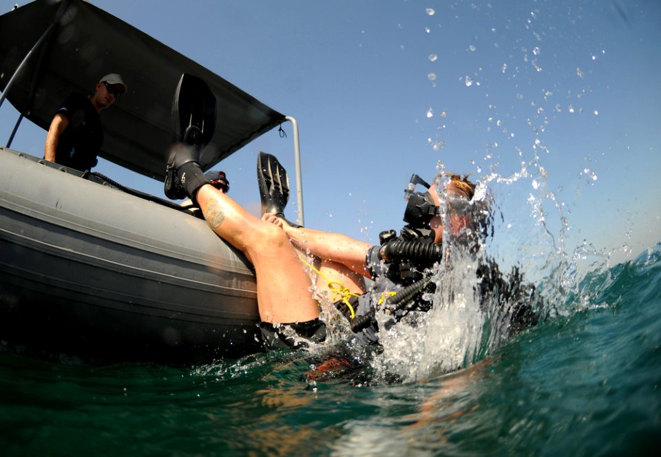 US Navy 101025-N-0413B-067 Navy Diver 1st Class Christopher Juelsgaard enters the water during a training dive
