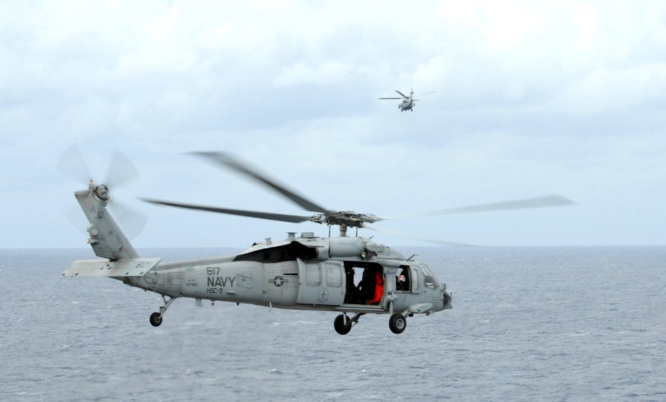 US Navy 101025-N-8560K-022 MH-60S Sea Hawk helicopters assigned to Helicopter Sea Combat Squadron (HSC) 9 take off from the aircraft carrier USS Ge