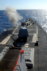 US Navy 101026-N-1854W-066 The guided-missile destroyer USS Mitscher (DDG 57) fires its forward 5-inch Mark 45-54-caliber lightweight gun during a