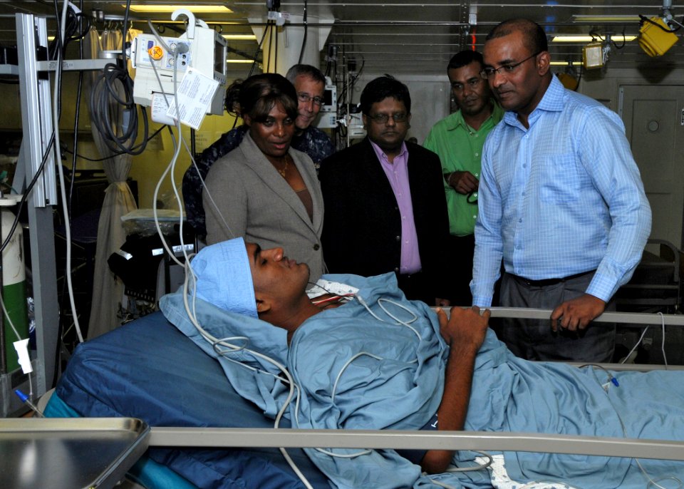 US Navy 101025-N-7680E-076 President of Guyana Bharat Jagdeo visits a Guyanese patient who underwent a medical procedure aboard the multi-purpose a