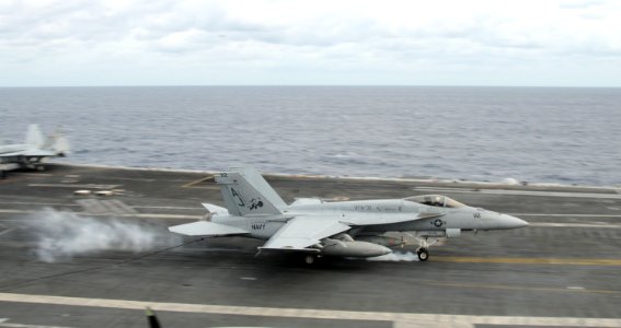 US Navy 101025-N-8560K-153 An F-A-18E Super Hornet assigned to Strike Fighter Squadron (VFA) 31 catches an arresting wire aboard the aircraft carri