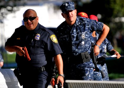 US Navy 101028-N-2055M-318 Florentino Herrera, a police officer at Commander, Navy Region Southwest, leads his team of security officers to the Pac photo