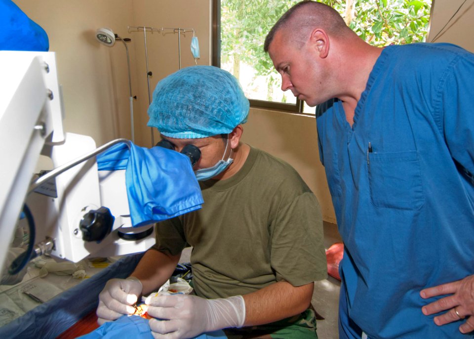 US Navy 101028-N-6770T-085 Senior Chief Hospital Corpsman Thomas Gilham, assigned to Commander Task Force 73 in Singapore, watches Royal Cambodian