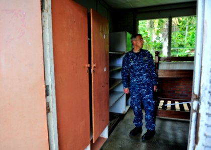 US Navy 101028-N-1531D-165 Capt. Thomas Negus, commodore of Continuing Promise 2010, tours a school's dormitory before a Continuing Promise enginee