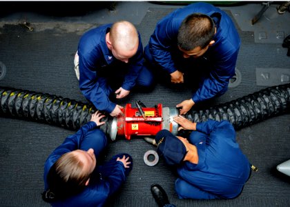 US Navy 101026-N-2908M-006 Sailors aboard the amphibious assault ship USS Kearsage (LHD 3) conduct damage control training on a ventilation fan dur