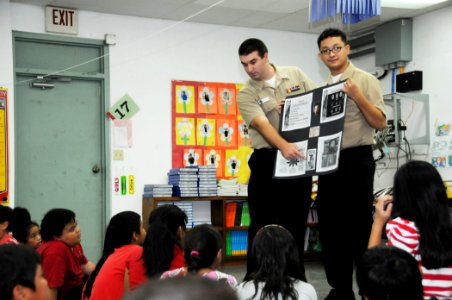 US Navy 101029-N-1906L-011 Logistics Specialists 2nd Class Jeffrey Spear, left, and Ryan Estrella, both assigned to U.S. Naval Hospital Guam, talk