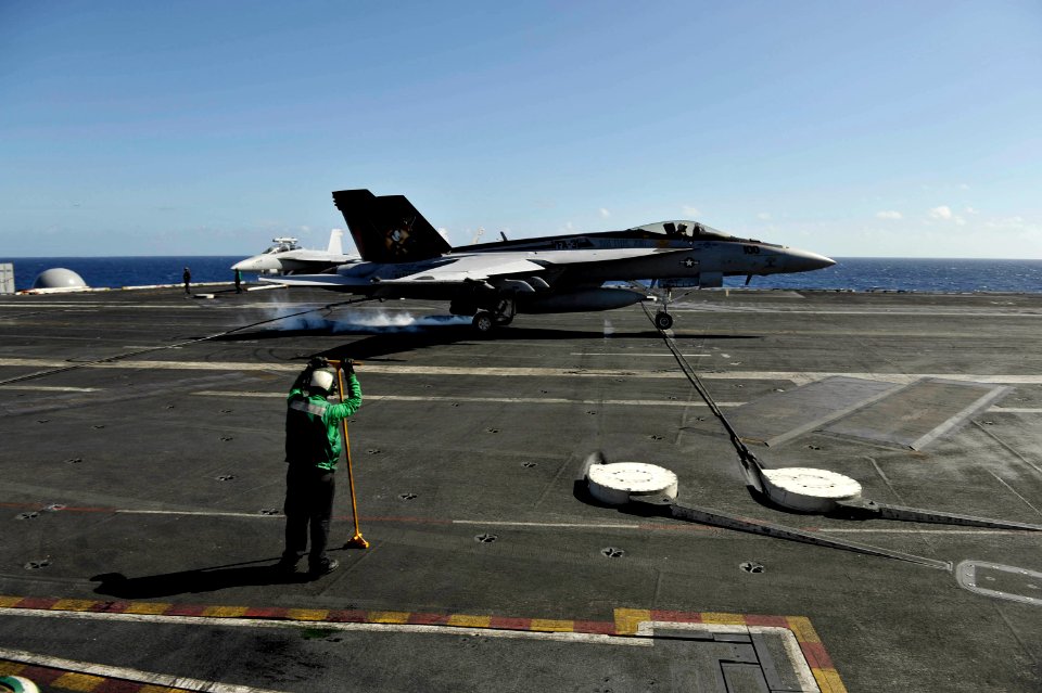 US Navy 101026-N-6889J-229 An F-A-18E Super Hornet assigned to Strike Fighter Squadron (VFA) 31 lands aboard the aircraft carrier USS George H.W. B