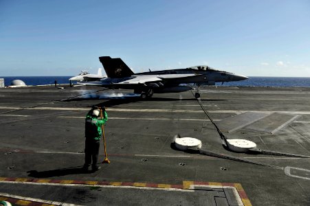 US Navy 101026-N-6889J-229 An F-A-18E Super Hornet assigned to Strike Fighter Squadron (VFA) 31 lands aboard the aircraft carrier USS George H.W. B photo