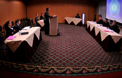 US Navy 101029-N-5812W-010 Cara Condit, a student from Suffolk University Law School delivers her argument to a panel of military judges