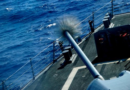 US Navy 101026-N-8913A-026 The guided-missile destroyer USS Mitscher (DDG 57) fires its forward 5-inch Mark 45-54-caliber lightweight gun during a