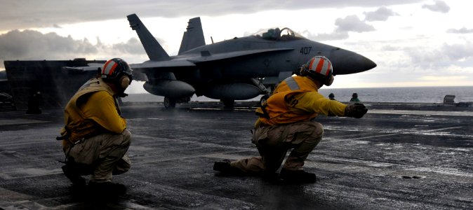 US Navy 101026-N-7103C-183 An F-A 18C Hornet assigned to the Dambusters of Strike Fighter Squadron (VFA) 195 launches from the aircraft carrier USS