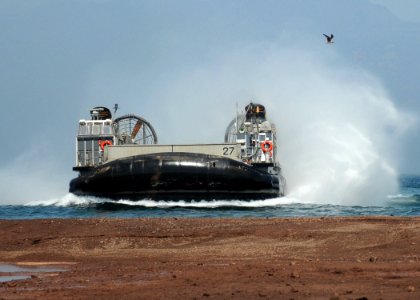 US Navy 101026-N-8069G-418 A landing craft air cushion (LCAC) from the amphibious dock landing ship USS Carter Hall (LSD 50) arrives on the beach d