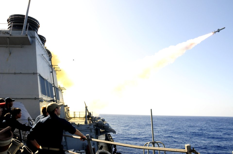 US Navy 101027-N-8913A-004 Sailors aboard the guided-missile destroyer USS Mitscher (DDG 57) observe a Harpoon anti-ship missile as it launches fro