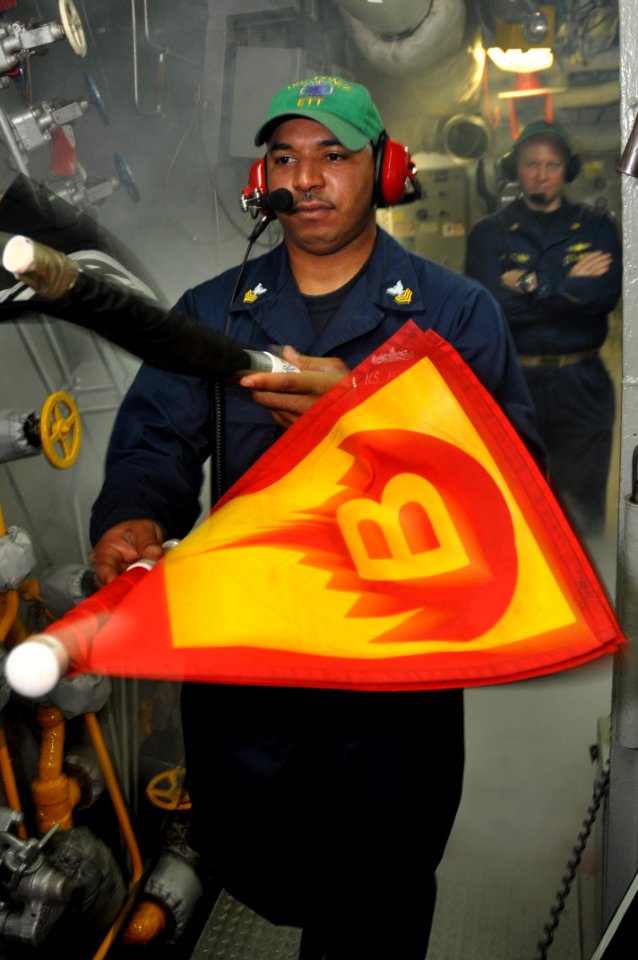 US Navy 101031-N-7293M-087 Lt. Cmdr. Donovan Wortham, chief engineer aboard the amphibious transport dock ship USS Ponce (LPD 15), observes Machini