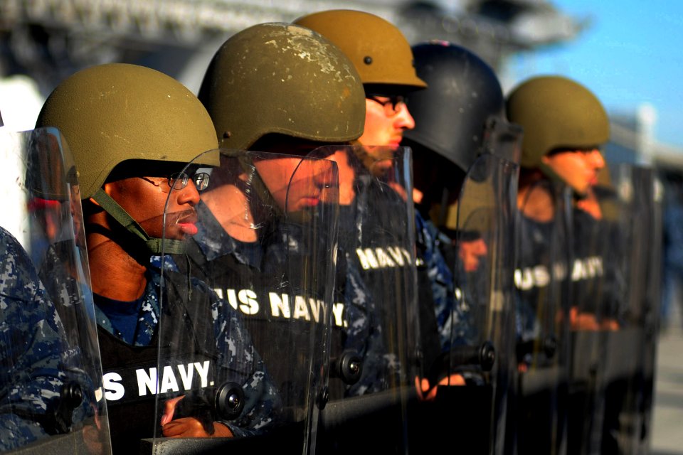 US Navy 101028-N-2953W-371 Sailors assigned to the security department of the aircraft carrier USS Carl Vinson (CVN 70) respond to a simulated riot
