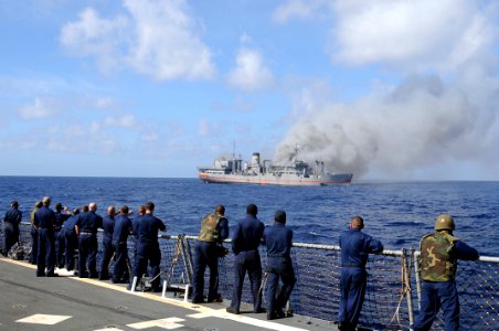 US Navy 101027-N-1854W-115 Sailors aboard the guided-missile destroyer USS Mitscher (DDG 57) observe the approach of the ex-USNS Saturn during a si