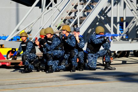 US Navy 101028-N-2953W-151 Sailors assigned to the security department of the aircraft carrier USS Carl Vinson (CVN 70) prepare to clear the pier d