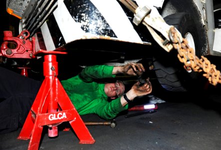 US Navy 101102-N-6362C-025 Aviation Support Equipment Technician Airman Bryant Scallorn, from Memphis, Tenn., performs a front-end tie rod adjustme