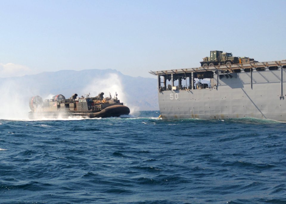 US Navy 101102-N-8069G-491 A landing craft air cushion (LCAC) enters the well deck of the amphibious dock landing ship USS Carter Hall (LSD 50) aft