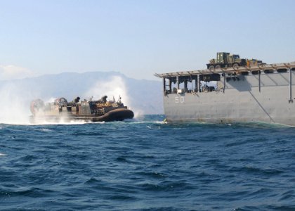 US Navy 101102-N-8069G-491 A landing craft air cushion (LCAC) enters the well deck of the amphibious dock landing ship USS Carter Hall (LSD 50) aft photo