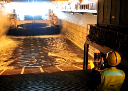US Navy 101104-N-1722W-151 A Sailor aboard the amphibious assault ship USS Boxer (LHD 4) guides a landing craft air cushion (LCAC) operated by Mari