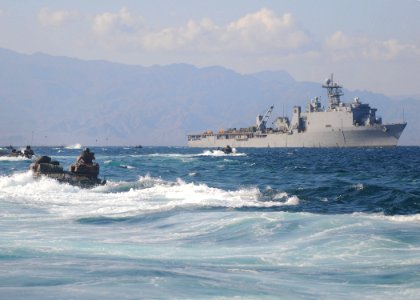 US Navy 101102-N-8069G-271 Marines assigned to the 26th Marine Expeditionary Unit (26th MEU) approach the amphibious dock landing ship USS Carter H