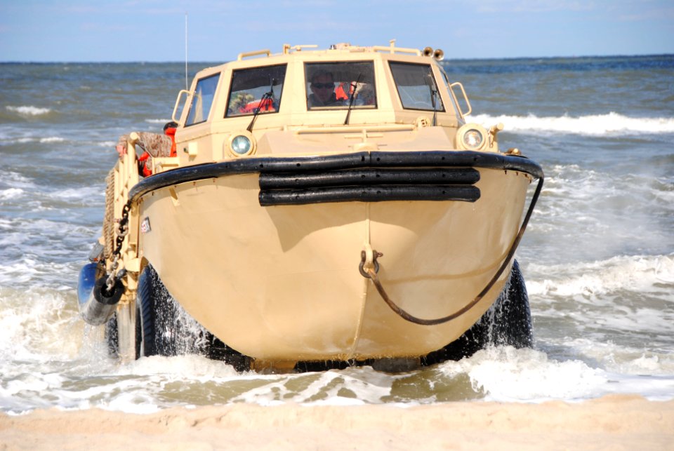 US Navy 101029-N-1580K-128 A lighter amphibious re-supply cargo (LARC) vehicle emerges from the surf to deliver its payload onto Anzio Beach at Joi