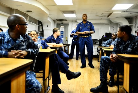 US Navy 101104-N-6003P-021 Senior Chief Electronics Technician Michael France instructs Sailors aboard the aircraft carrier USS Harry S. Truman (CV