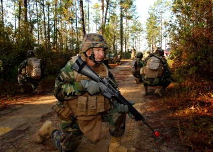 US Navy 101104-N-8816D-003 Chief Construction Mechanic James Sawyer participates in a training patrol during a khaki field training exercise photo