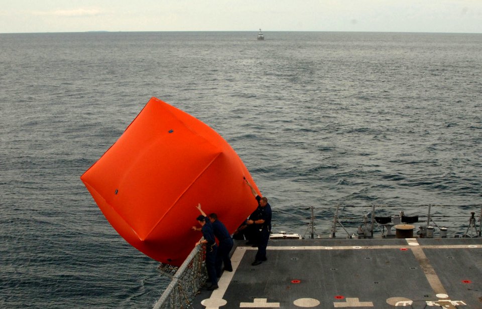 US Navy 101028-N-9156C-073 Sailors aboard the guided-missile frigate USS Commelin (FFG 37) launch an inflatable target