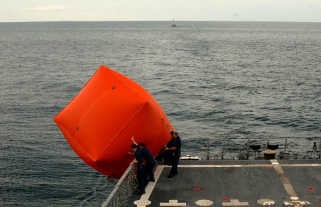 US Navy 101028-N-9156C-073 Sailors aboard the guided-missile frigate USS Commelin (FFG 37) launch an inflatable target