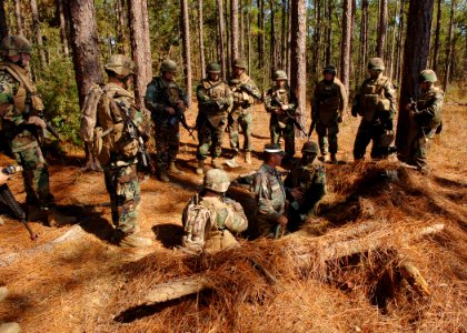 US Navy 101104-N-8816D-007 Training personnel evaluate the fighting positions of chiefs and officers assigned to Naval Mobile Construction Battalio