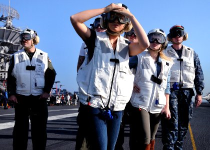 US Navy 101105-N-7095C-084 Rachel Reinert, left, and Cheyenne Kimball, performers with the country music band Gloriana, watch flight operations abo