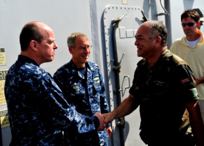 US Navy 101030-N-1531D-023 Capt. Thomas Chassee, commanding officer of the multi-purpose amphibious assault ship USS Iwo Jima (LHD 7), greets Chief photo
