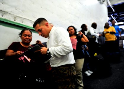 US Navy 101030-N-1531D-249 gt. Nelson Cuba, from Bronx, New York, assigned to Special Purpose, Marine Air Ground Task Force, checks in patients fro