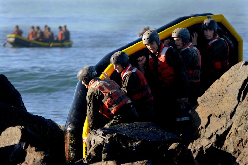US Navy 101102-N-7883G-133 Students from Basic Underwater Demolition-SEAL (BUD-s) class 286 participate in a rock portage exercise