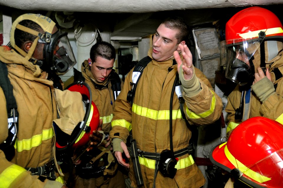 US Navy 101031-N-7293M-138 Sailors debrief after a main space fire drill aboard the amphibious transport dock ship USS Ponce (LPD 15)