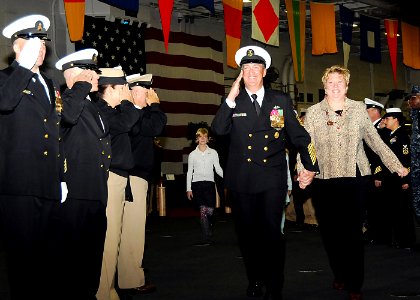 US Navy 101105-N-8560K-244 Fleet Master Chief Thomas Howard and family are rendered side boy honors at the conclusion of Howard's retirement ceremo
