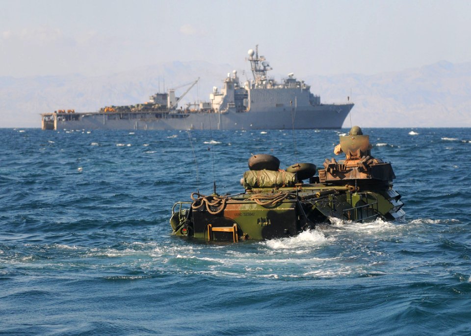 US Navy 101102-N-8069G-374 Marines assigned to the 26th Marine Expeditionary Unit (26th MEU) approach the amphibious dock landing ship USS Carter H