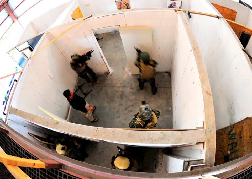 US Navy 101104-N-4044H-133 Navy SEALs conduct close quarters combat training in a simulated home at U.S. Training Center Moyock